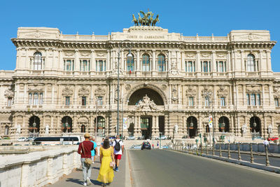 Group of people in front of historical building