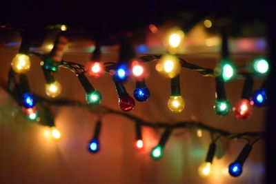 Close-up of illuminated lights at night