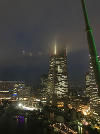 Illuminated buildings in city at night