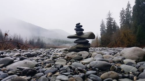 View of pebbles on mountain against sky