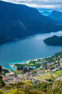 High angle view of townscape by sea against sky