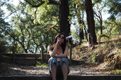 Woman sitting in a forest