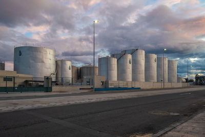 View of factory against cloudy sky