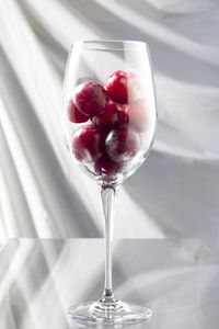 Close-up of strawberry on glass table