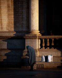 People outside temple in building