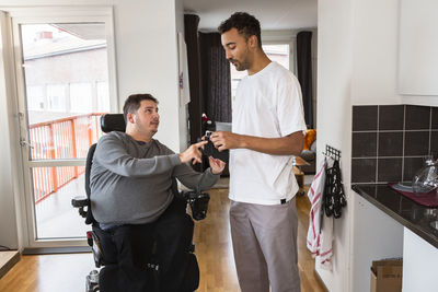 Career helping man in wheelchair