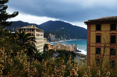 Buildings against cloudy sky