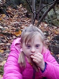 Portrait of a girl with autumn leaves