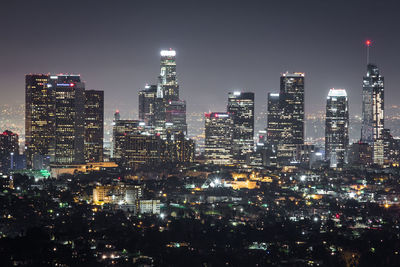 Aerial view of city lit up at night