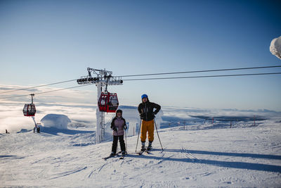 People skiing in ski resort in winter