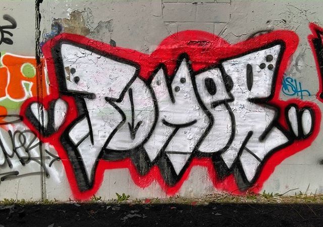 graffiti, creativity, art and craft, art, text, wall - building feature, red, street art, western script, communication, multi colored, wall, close-up, human representation, painted, capital letter, paint, no people, pattern, textured