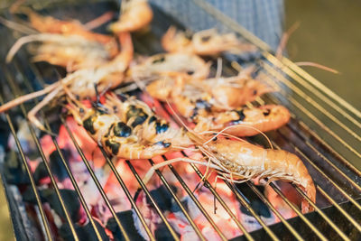 High angle view of meat on barbecue