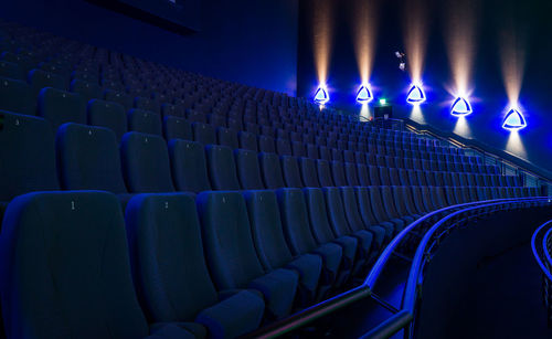 Empty blue seats in movie theater
