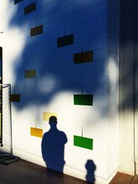 Woman standing against wall