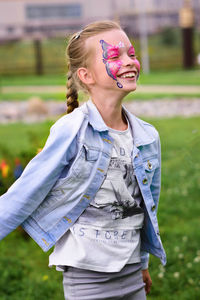 Portrait of girl with butterfly face paint