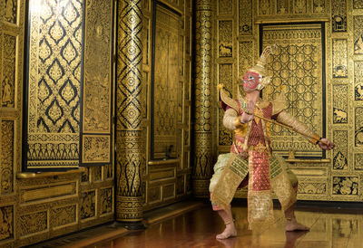 Is a classic thai dance in a mask. this is giant and he is the one of characters from the ramayana