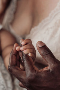 Close-up of man holding hands