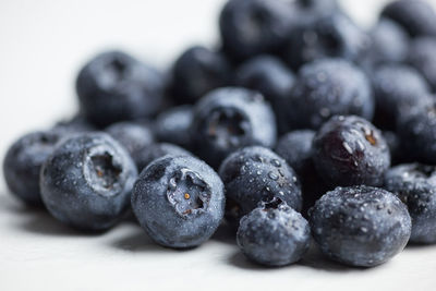 Close-up of blueberries against white background