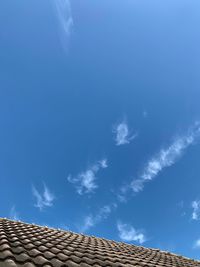 Low angle view of building against blue sky