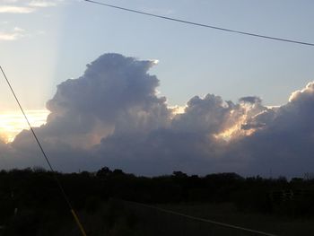 Scenic view of landscape against cloudy sky