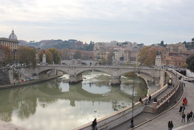 High angle view of bridge over river in city against sky