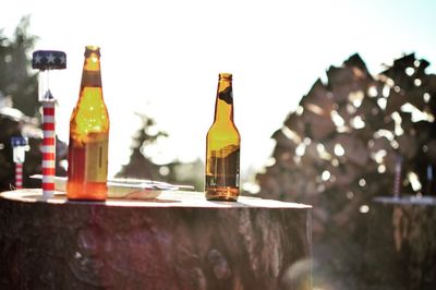 Close-up of wine bottles against clear sky