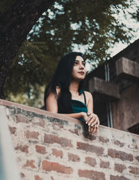 Portrait of a young woman looking away