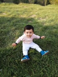 Portrait of cute boy on grass