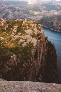 View of camping tents near edge of cliff in norway