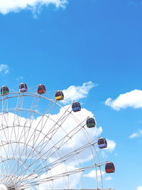 Low angle view of ferris wheel against sky