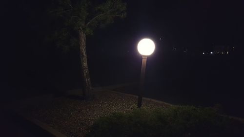 View of illuminated street light at night