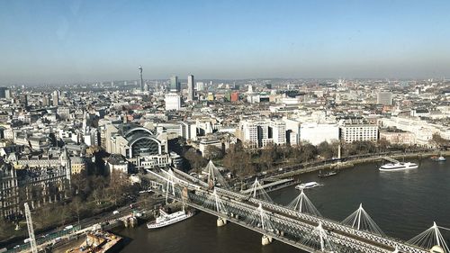 High angle view of river amidst buildings in city against sky