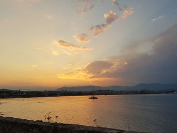 Scenic view of sea against sky at sunset