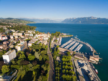 High angle view of buildings by sea against sky