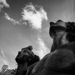 Low angle view of statue against cloudy sky