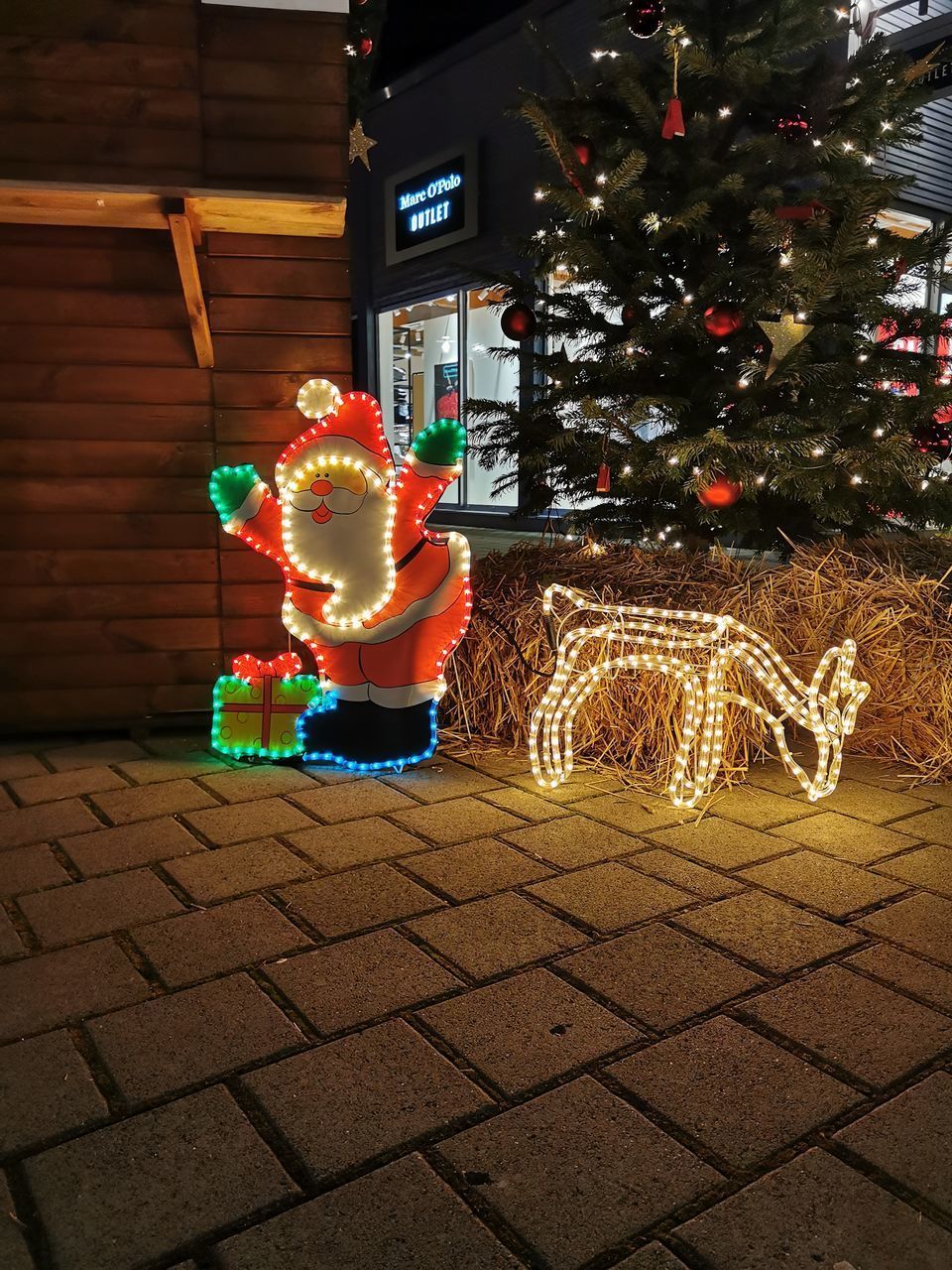 ILLUMINATED CHRISTMAS TREE AT NIGHT DURING FESTIVAL