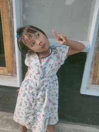 Full length of cute girl standing at home