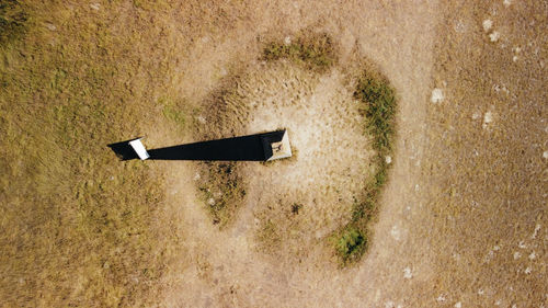High angle view of arrow sign on wall