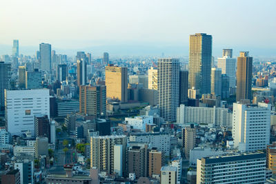 Modern buildings in city against sky