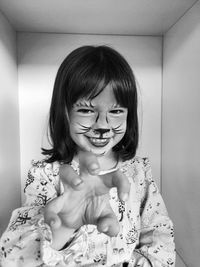 Portrait of a smiling young woman at home