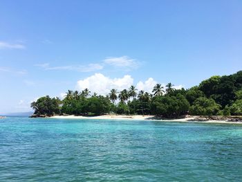 Scenic view of sea against blue sky