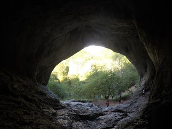 Scenic view of cave seen through tunnel