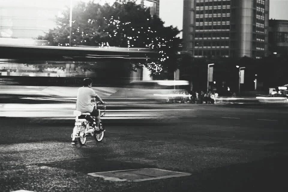 transportation, mode of transport, building exterior, city, architecture, land vehicle, street, built structure, bicycle, full length, road, car, city life, side view, outdoors, night, men, on the move