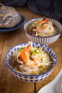 High angle view of shrimp soup in bowl on table