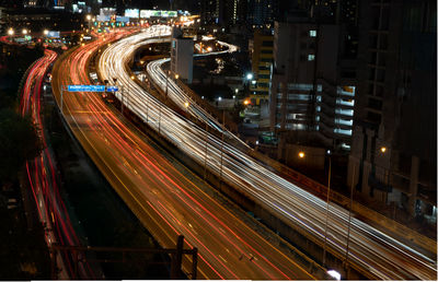 High angle view of light trails on road at night