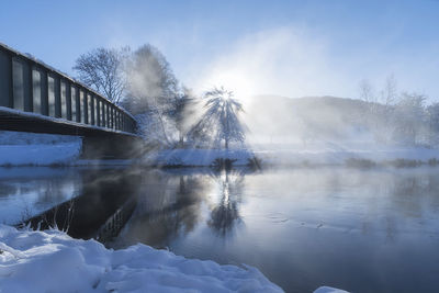 Lake against sky during winter