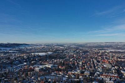 Aerial view of cityscape against sky