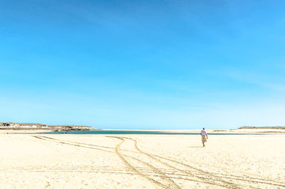 Scenic view of beach against clear sky