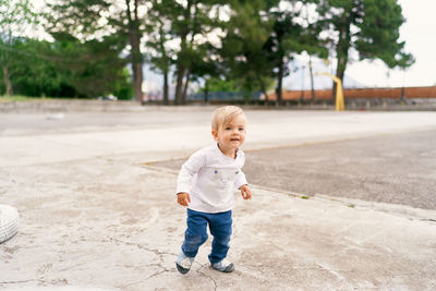 Full length of cute boy outdoors