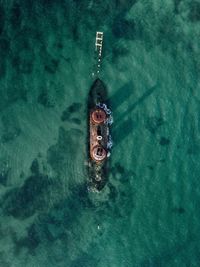 Directly above shot wrecked ship in sea